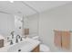 Clean bathroom featuring a modern sink, vanity, and large mirror, offering a bright and functional space at 1465 Gulf Of Mexico Dr # 104, Longboat Key, FL 34228