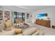 Spacious living room featuring access to a balcony with beautiful views at 1465 Gulf Of Mexico Dr # 104, Longboat Key, FL 34228
