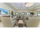 Bright lounge area featuring comfortable seating, neutral tones, and a flat-screen TV at 1465 Gulf Of Mexico Dr # 104, Longboat Key, FL 34228