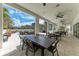 Outdoor dining area with covered seating and views of the city skyline at 1465 Gulf Of Mexico Dr # 104, Longboat Key, FL 34228