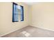 A well-lit bedroom showcasing natural light through a window at 16612 Myrtle Sand Dr, Wimauma, FL 33598