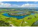 Beautiful aerial view of the community featuring a lake and golf course at 16904 Vardon Ter # 204, Bradenton, FL 34211