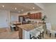 Kitchen featuring granite counters, a breakfast bar, and stainless steel appliances at 16904 Vardon Ter # 204, Bradenton, FL 34211