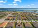 Aerial view of waterfront community of similar-styled single-Gathering homes with circle highlighting subject property at 1805 7Th St E, Palmetto, FL 34221