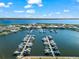 Aerial view of a marina with boats docked, surrounded by waterfront homes in a picturesque community at 1805 7Th St E, Palmetto, FL 34221