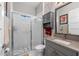 Bathroom with shower, toilet, sink with cabinets, and wall mirror at 1805 7Th St E, Palmetto, FL 34221
