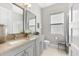 Bathroom featuring a double sink vanity, quartz countertops, and modern fixtures at 1805 7Th St E, Palmetto, FL 34221