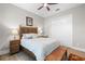 Bedroom with hardwood floors, ceiling fan, bedside lamps, comfortable bed, and sliding door closet at 1805 7Th St E, Palmetto, FL 34221