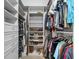 Organized walk-in closet with shelves, drawers, rods for hanging clothes and shoe racks at 1805 7Th St E, Palmetto, FL 34221