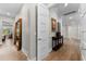 Bright hallway with stylish flooring, decor and multiple doors leading to other rooms at 1805 7Th St E, Palmetto, FL 34221