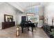 Elegant living room featuring a grand piano, hardwood floors, and sophisticated decor at 1805 7Th St E, Palmetto, FL 34221