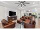 Inviting living room features a fireplace, modern furnishings and lots of light at 1805 7Th St E, Palmetto, FL 34221