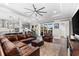 Open floor plan features modern furnishings, hardwood floors, a neutral color palette and plenty of light at 1805 7Th St E, Palmetto, FL 34221