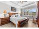 Bright bedroom features a ceiling fan, hardwood floors, and a window with natural light at 1805 7Th St E, Palmetto, FL 34221