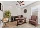 A home office with hardwood floors, ceiling fan, wooden desk and furniture, and natural light from a window at 1805 7Th St E, Palmetto, FL 34221