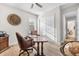 A well lit home office with hardwood floors and white closets with sliding doors, perfect for a home business at 1805 7Th St E, Palmetto, FL 34221