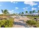 Outdoor community seating area with grills, tables, chairs, and tropical landscaping at 1805 7Th St E, Palmetto, FL 34221
