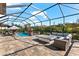 Spacious outdoor patio includes a fire pit, comfortable seating, and views of the refreshing pool at 1805 7Th St E, Palmetto, FL 34221