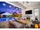 Outdoor patio featuring a pool, outdoor seating, a fireplace, and string lights at twilight at 1805 7Th St E, Palmetto, FL 34221