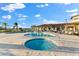 Community pool with hot tub, ample seating, and lush landscaping at 1805 7Th St E, Palmetto, FL 34221