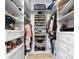 Walk-in closet features custom shelving, drawers, and ample storage for clothes and accessories at 1805 7Th St E, Palmetto, FL 34221