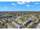 Aerial view of a condo complex featuring pools, parking, and manicured lawns at 1807 Sunny Dr # E4, Bradenton, FL 34207