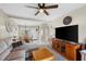 Relaxing living room with a beige sectional sofa, wood furniture, and dining area in view at 1807 Sunny Dr # E4, Bradenton, FL 34207