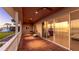 Spacious covered balcony featuring tile flooring and large sliding glass doors, perfect for enjoying outdoor living at 202 Gaines Ave, Sarasota, FL 34243