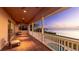 Picturesque balcony view with ample seating space, offering stunning waterfront views and relaxing sunset vistas at 202 Gaines Ave, Sarasota, FL 34243