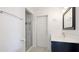 Simple bathroom featuring a glass shower, black and white tile flooring, and a modern vanity at 202 Gaines Ave, Sarasota, FL 34243