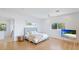 Comfortable bedroom with bright white walls and a plush queen-size bed at 202 Gaines Ave, Sarasota, FL 34243
