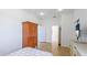 Bright bedroom boasts wood floors, a spacious wardrobe, and a large window at 202 Gaines Ave, Sarasota, FL 34243