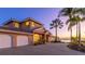 Beautiful waterfront home with brick driveway and three-car garage offers stunning sunset views at 202 Gaines Ave, Sarasota, FL 34243