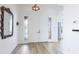 Spacious foyer features a large mirror and double-door entry, creating a welcoming ambiance at 202 Gaines Ave, Sarasota, FL 34243
