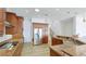 Bright kitchen features custom wood cabinets, stainless appliances, and granite countertops at 202 Gaines Ave, Sarasota, FL 34243