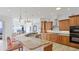 The spacious kitchen has custom cabinetry, granite countertops, and a breakfast bar with stunning water views at 202 Gaines Ave, Sarasota, FL 34243