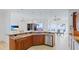 Open kitchen and living space with a breakfast bar, offering picturesque views of the waterfront at 202 Gaines Ave, Sarasota, FL 34243