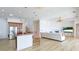 Open-concept living area features bright white decor, wood floors, and natural light at 202 Gaines Ave, Sarasota, FL 34243
