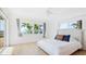 Inviting main bedroom with views of the waterfront, wood floors, and an airy feel at 202 Gaines Ave, Sarasota, FL 34243