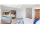 Main bedroom with a walkout to the lanai and pool, a ceiling fan, and wood floors at 202 Gaines Ave, Sarasota, FL 34243