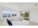 Bright main bedroom with views of the pool and waterfront, wood floors, and ample light at 202 Gaines Ave, Sarasota, FL 34243
