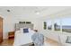 Charming main bedroom with views of the waterfront, wood floors, and an airy feel at 202 Gaines Ave, Sarasota, FL 34243
