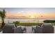 Tranquil outdoor seating area with a mesmerizing view of the water and picturesque sunset backdrop at 202 Gaines Ave, Sarasota, FL 34243