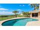 Backyard pool overlooks a sunny waterfront with a large yard at 202 Gaines Ave, Sarasota, FL 34243