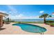 Backyard pool overlooks a scenic view of the ocean on a clear and sunny day at 202 Gaines Ave, Sarasota, FL 34243