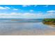 Expansive waterfront view with shallow water and clear blue skies at 202 Gaines Ave, Sarasota, FL 34243