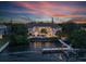Waterfront home featuring a pool, outdoor living space, and private dock on the water at 212 Haverkos Ct, Holmes Beach, FL 34217