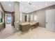 Bright bathroom with double sinks, modern fixtures, and views of the property's water access at 212 Haverkos Ct, Holmes Beach, FL 34217