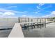 Dockside view with a boat lift for easy access to the water at 212 Haverkos Ct, Holmes Beach, FL 34217