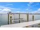 Dockside view of a boat lift for easy access to the water at 212 Haverkos Ct, Holmes Beach, FL 34217